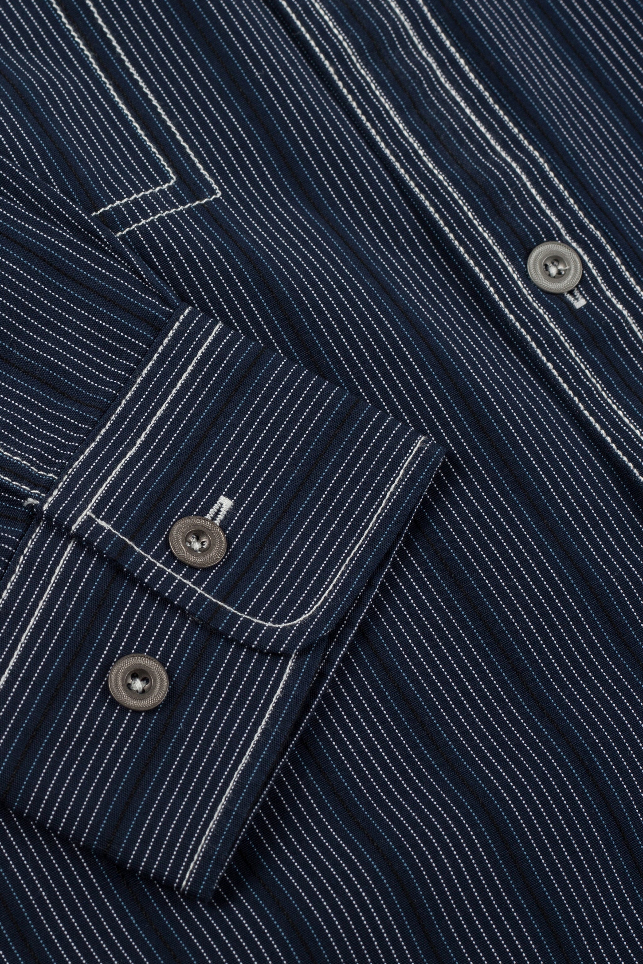 a close up of a blue and white striped shirt