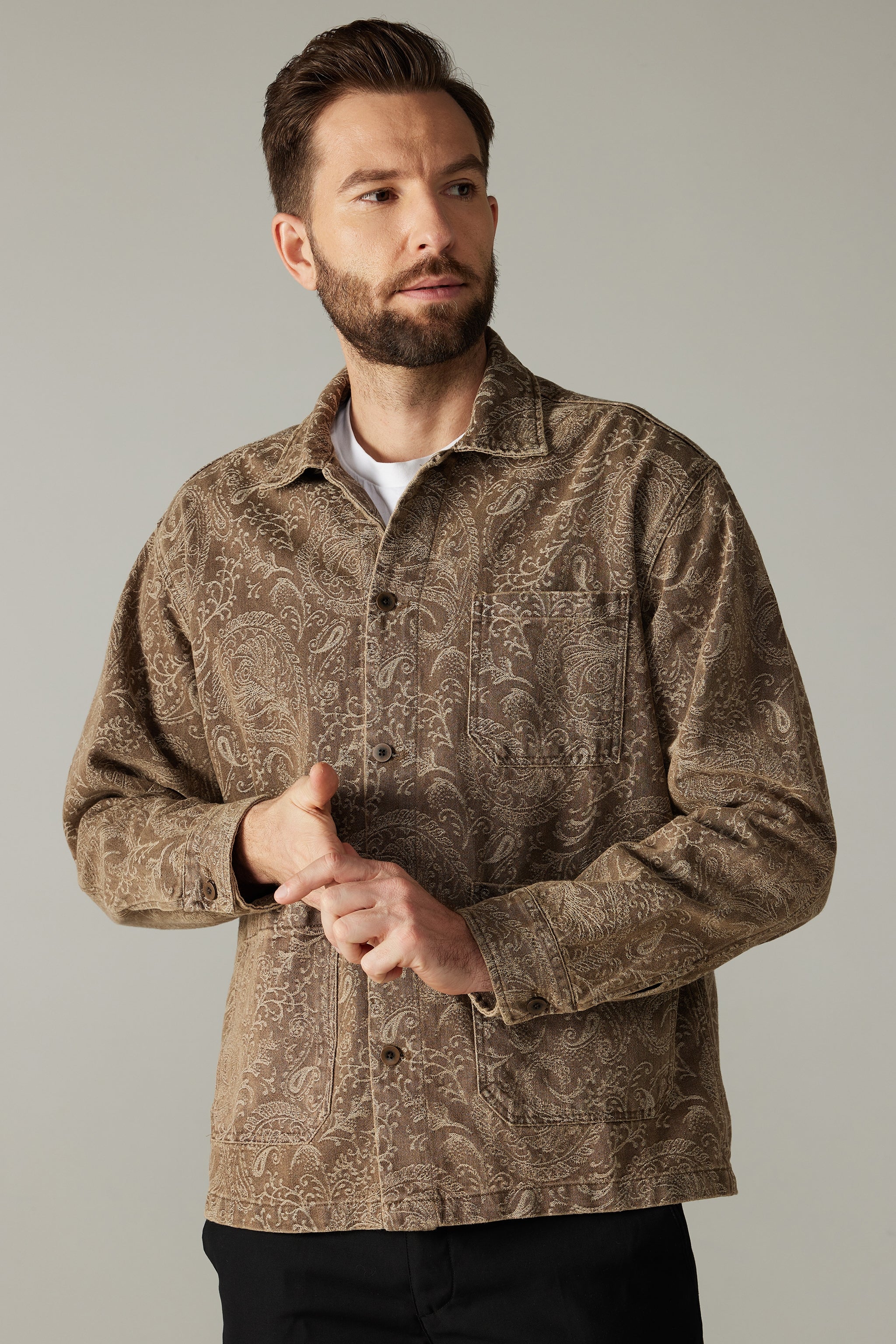 a man with a beard wearing a jacket