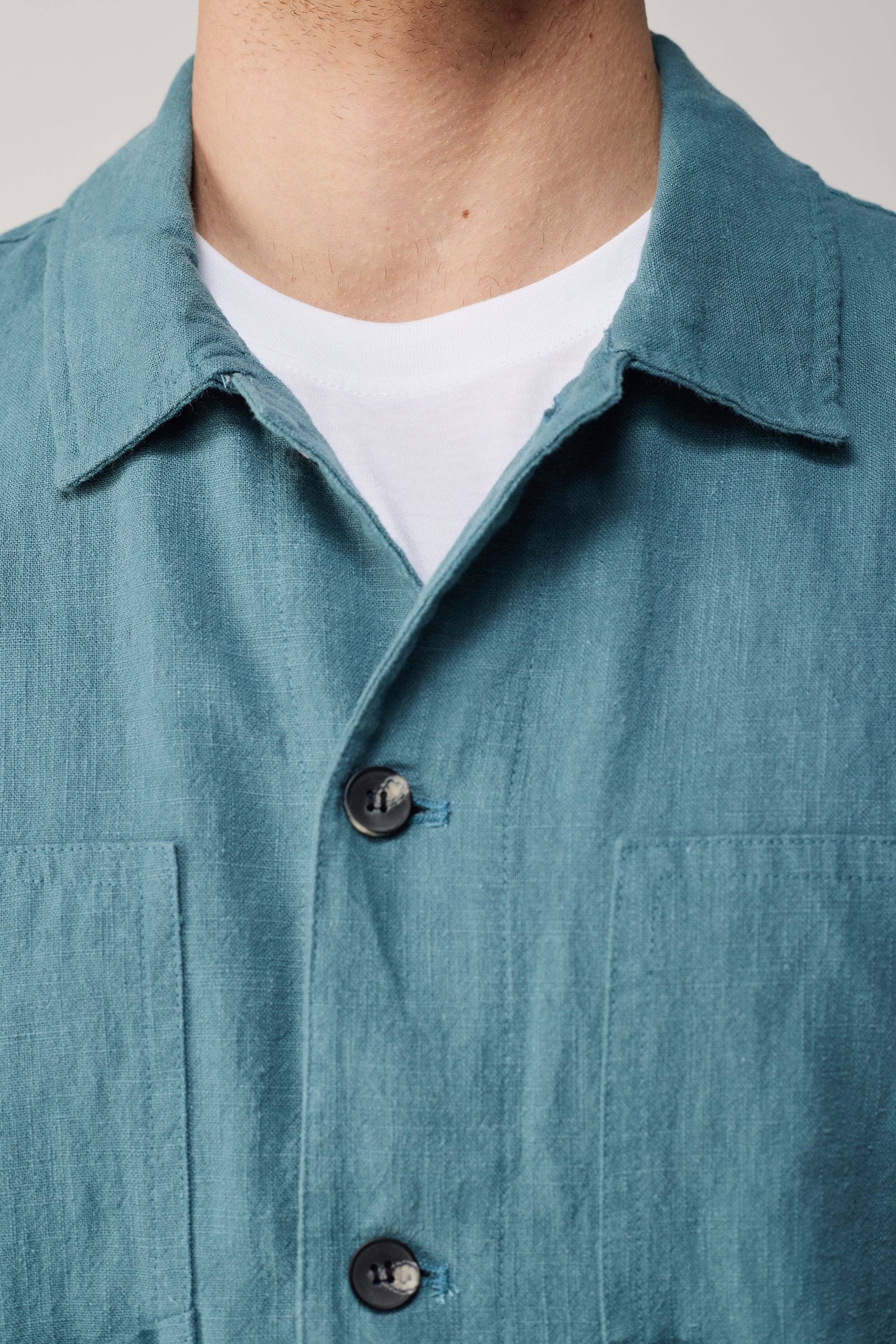 a close up of a person wearing a blue shirt