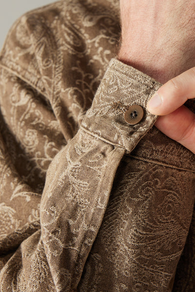 a brown jacket with a paisley pattern on it