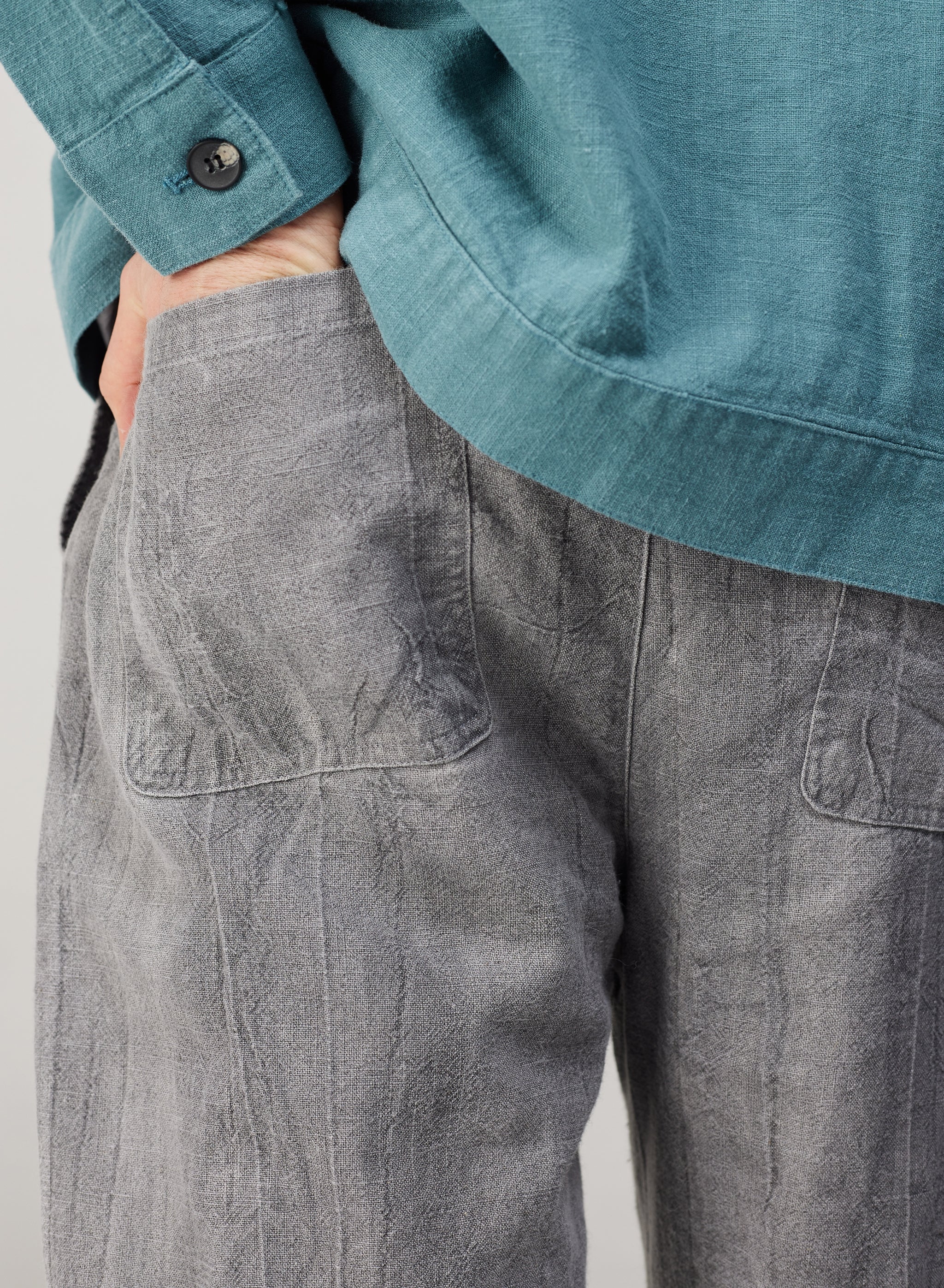 a pair of grey pants with a drawstring